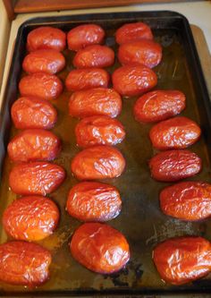 tomatoes are being cooked on a baking sheet in the oven for roasting and cooking