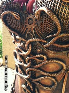 an old boot is covered with rope and other things that are in the bottom part of it