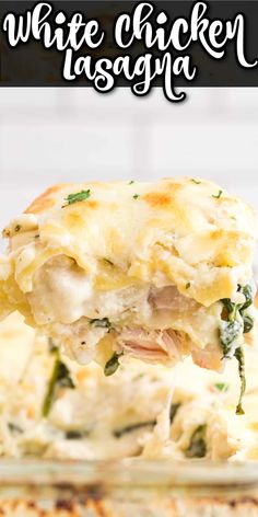 a white chicken lasagna is being lifted from the casserole dish