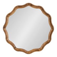 a round mirror with wooden frame on the top and bottom, in an antique style