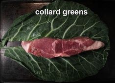 a piece of meat sitting on top of a leafy green plate with the words collard greens