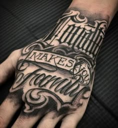 a man's hand with a tattoo on it