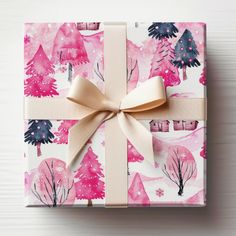 a present wrapped in pink and white wrapping paper