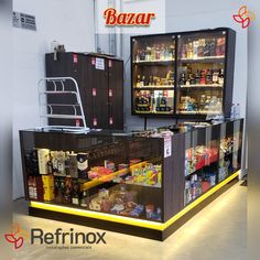 a display case filled with lots of food and drinks in a warehouse or office building