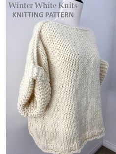 a white knitted sweater hanging on a mannequin's dummy head with the words winter white knits written below it