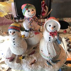 two snowmen sitting on top of each other