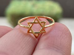 Gold Plated Star of David Ring * Magen David Ring * Jewish Jewelry * Six Wings Kabbalistic Unisex Religious * Spiritual * Minimalist Sweet and simple Star of David ring Material: 14K Gold Plated over 925 Sterling Silver  Qty: 1 pc.  Size: Multiple Sizes. Please choose your size from the drop down.  If you want this ring in silver please click here: https://www.etsy.com/listing/723831895/star-of-david-sterling-silver-jewish?click_key=eaffd10312aadff9d6044dbf47c8363ea4abb533%3A723831895&click_sum=3555cd50&ga_search_query=David&ref=shop_items_search_2&pro=1&frs=1 Thank you for visiting my shop! Star Of David Ring, Star Of David Jewelry, Jewish Ring, Jewish Artwork, Spiritual Ring, Jewish Stuff, David Ring, Boho Rings Gold, Clean Sterling Silver