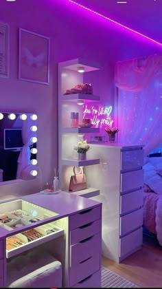 a bedroom with purple lighting and white furniture