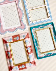 four different colored frames with flowers on them