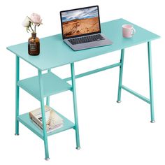 a laptop computer sitting on top of a blue desk next to a vase with flowers