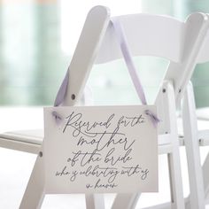 a white chair with a sign that says reserved for family off the groom