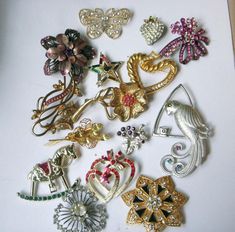 Large lot of 15 vintage rhinestone brooches--all wearable. You get everything in the photos.  None signed that I can see.  Some really beautiful ones in here.  This is NOT a junk lot.  No rhinestones missing.  Two of the brooches are not actually rhinestone (the matched red floral set), but the rest have rhinestones in them. Dates range from the 50's up to the 70's. Most from the 50's.   Please be sure to look at all the photos, as they are part of the description.  No returns on these. Gorgeous grouping!  An awesome price on these.  Great for resale.  I have more large resale lots for sale, so please see my shop. Sorry, but no international shipping at this time. Please see my shop for more vintage lots of jewelry: nightowlmemories.etsy.com Lots Of Jewelry, Vintage Rhinestone Brooch, Floral Set, Wichita Ks, Lots For Sale, Jewelry Beautiful, Rhinestone Brooches, Vintage Rhinestone, Beautiful One