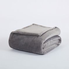 a gray blanket folded on top of each other