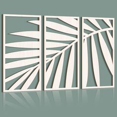 three panels with palm leaves cut out of them on a gray background, each panel has a different size and color