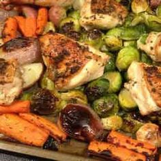 chicken, carrots and brussel sprouts in a pan