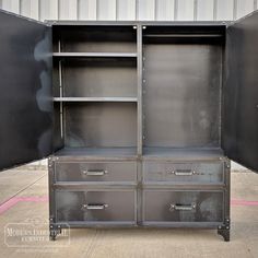 an open metal cabinet with two drawers