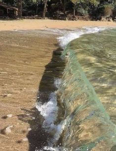 an ocean wave is coming towards the shore