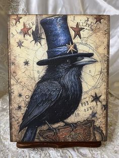 a black bird with a top hat on it's head and stars around its neck