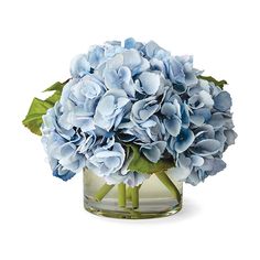 a vase filled with blue flowers on top of a table