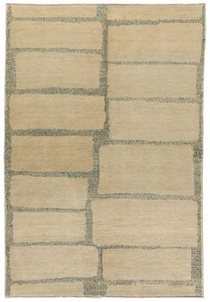 an area rug with squares and rectangles in beige, green and blue colors