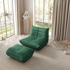 a green chair and ottoman in a room