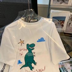 Olivia Mark - Cotton Fun Cartoon Print Short Sleeve T-Shirt with Stylish Loose Fit Dinosaur Shirt, Cartoon Dinosaur, Linen Short, Cool Cartoons, Dinosaur Print, Cartoon Print, Clothing Patterns, Workout Shorts, Printed Shorts