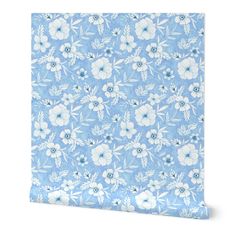 a blue and white flowered wallpaper with flowers on the bottom half of it