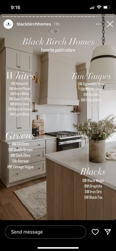 a kitchen with white cabinets and an island in front of the counter top is shown