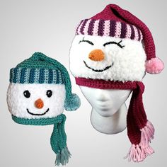 a knitted hat with a snowman's face wearing a red and white scarf