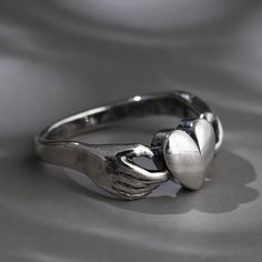 Jeulia "Claddagh" Heart Sterling Silver Ring, two hand hug one heart, this heart ring is similar with claddagh ring, but lack of crown, although you are not princess, but I can also hand my heart for you, please spend your future time with me.The heart rings convey the secret message of love is the most intuitive and easily understandable.Weight: 3.37 gWidth: 2.5 mmHeight: 3.5 mmThickness: 1.1 mmMaterial: Plating Color: Symbolic Heart-shaped Rings For Valentine's Day, Symbolic Heart Shaped Rings As Gifts, Symbolic Heart-shaped Wedding Ring, Symbolic Heart Shaped Wedding Rings, Symbolic Sterling Silver Heart Ring, Symbolic Heart-shaped Rings For Anniversary, Symbolic Heart-shaped Promise Ring, Symbolic Heart-shaped Anniversary Rings, Fede Ring