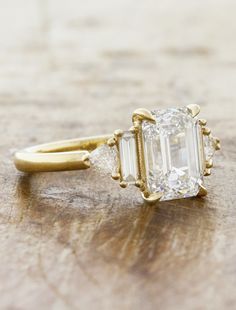 an engagement ring with two baguets on the side