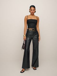 We make pants too.  Shop the Petites Veda Kennedy Wide Leg Leather Pant from Reformation, a high rise, loose fitting wide leg jean with a zip fly closure. Wide Leg Pants Outfit Party, Club Outfits For Women Jeans, Cute Outfits With Leather Pants, Pants Leather Outfit, Leather Wide Leg Pants Outfit, Wide Leg Leather Pant, Wide Leg Leather Pants Outfit, Leather Pant Outfits, Leather Pants Outfits