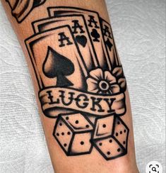 a black and white tattoo with playing cards on it