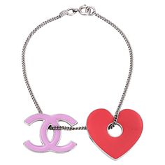 Overview: Pre-owned Chanel bracelet fitted with a CC logo and heart charm. The bracelet measures 7 1/2 inches in length and is fitted with larger 1" charms. The bracelet dates to the 2004 Spring collection. The bracelet is in very good condition. The lacquer is free of cracks or chips. Particulars: Weight: 10.8 grams Stones: N/A. Size & Measurements: The bracelet measures 7 1/2 inches in length and is fitted with larger 1" charms. Metal & Hallmark: White tone metal. The bracelet is hallmarked "C Chanel Charm Bracelet, Chanel Charm, Chanel Bracelet, Spring Bracelet, Modern Bracelets, White Tone, Gold Charm Bracelet, Classy Jewelry, Chanel Jewelry