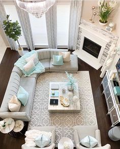 an aerial view of a living room with couches, chairs and coffee table in it