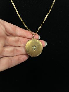 This lovely gold-filled European seed-pearl-centered starburst locket will speak volumes with its elegant simplicity. It features an engraved star with blue-stone-studded delicate rays and an interesting engraved pattern along its perimeter. This gem of a locket hangs on a cool vintage textured gold-filled chain. Hinges open from the top. Vintage Gold Star Jewelry, Vintage Star Necklace For Gift, Yellow Gold Brass Jewelry With Star Charm, Elegant Brass Jewelry With Star Charm, Elegant Star-shaped Brass Jewelry, Celestial Pendant Locket Jewelry, Vintage Star-shaped Wedding Jewelry, Gold Pendant Locket Necklace With Birthstone, Gold Wedding Jewelry With Star Charm