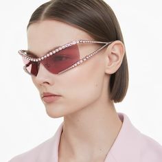 Edgy and extravagant, these bold sunglasses take inspiration from Swarovski’s Matrix family. The pink lenses are embellished with lines of prong-set pink crystals that wrap entirely around the top and bottom of the silver-tone frames. At each side, distinctive triangular temples create a look that exudes futuristic chic. Choose this pair when you really want to steal the spotlight. Bold Sunglasses, Swarovski Sunglasses, Pink Lenses, Stackable Ring Sets, Rhinestone Sunglasses, Swarovski Glasses, Pink Watch, Pink Swarovski, Rose Gold Watches