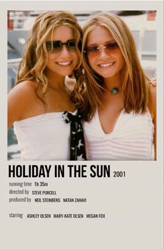 two beautiful young women standing next to each other in front of a white poster with the words holiday in the sun