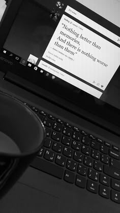 an open laptop computer sitting on top of a desk next to a mouse and keyboard