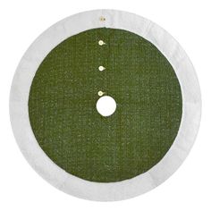 a green and white circular object with holes in the center