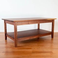 a wooden table sitting on top of a hard wood floor