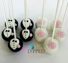 cake pops decorated with white and pink frosting are arranged next to each other on a table