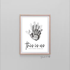 this is us hand print in black and white with the words,'this is us '