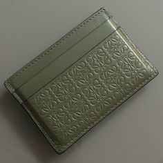 LOEWE Monogram Repeat Cardholder in Avocado Green Loewe Card Holder, Card Holder Aesthetic, Loewe Monogram, Aesthetic Wallet, Loewe Handbags, Handcrafted Leather Wallet, Loewe Anagram, Accessory Inspo, Card Purse