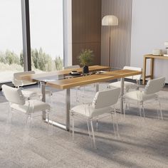 a dining room table with chairs and a plant in the center, near a window