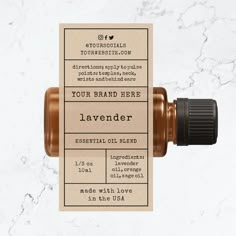 the label for an essential oil blend on a marble background with a black and brown bottle