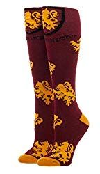 a pair of red socks with yellow lions on them