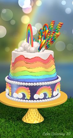 there is a multi layer cake with rainbows on it and candy sticks sticking out of the top