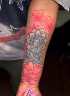 a person with a flower tattoo on their arm