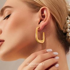 Make a bold statement with these Large U-Shaped Hoop Earrings, featuring a chunky gold design that's both modern and lightweight. Perfect for everyday wear or elevating your outfit with minimalist chic style. ---------------------------------------------------------- 💎[MATERIAL & MEASUREMENTS] - 1 Pair - 18k Real Gold plated over Stainless Steel - Width: 28mm / 1" - Length: 45mm /  1.8" - Tarnish-Resistant - Nickel & lead-free - Waterproof Minimalist Chic Style, Minimalist Fashion Chic, Hoop Earrings Chunky, Bold Earrings, Minimalist Chic, Earrings Minimalist, Gold Hoops, Jewelry Earrings Hoops, Gold Hoop